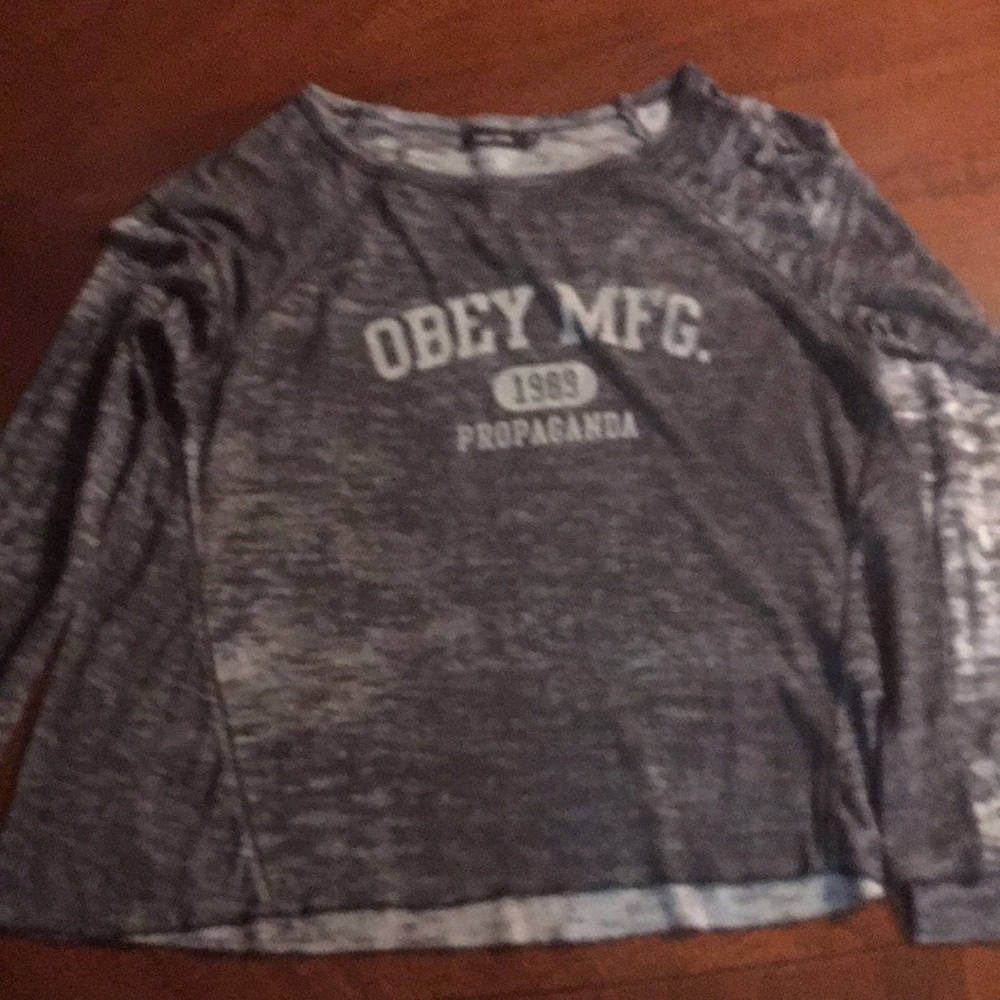 Long sleeved shirt that says obey meg.
